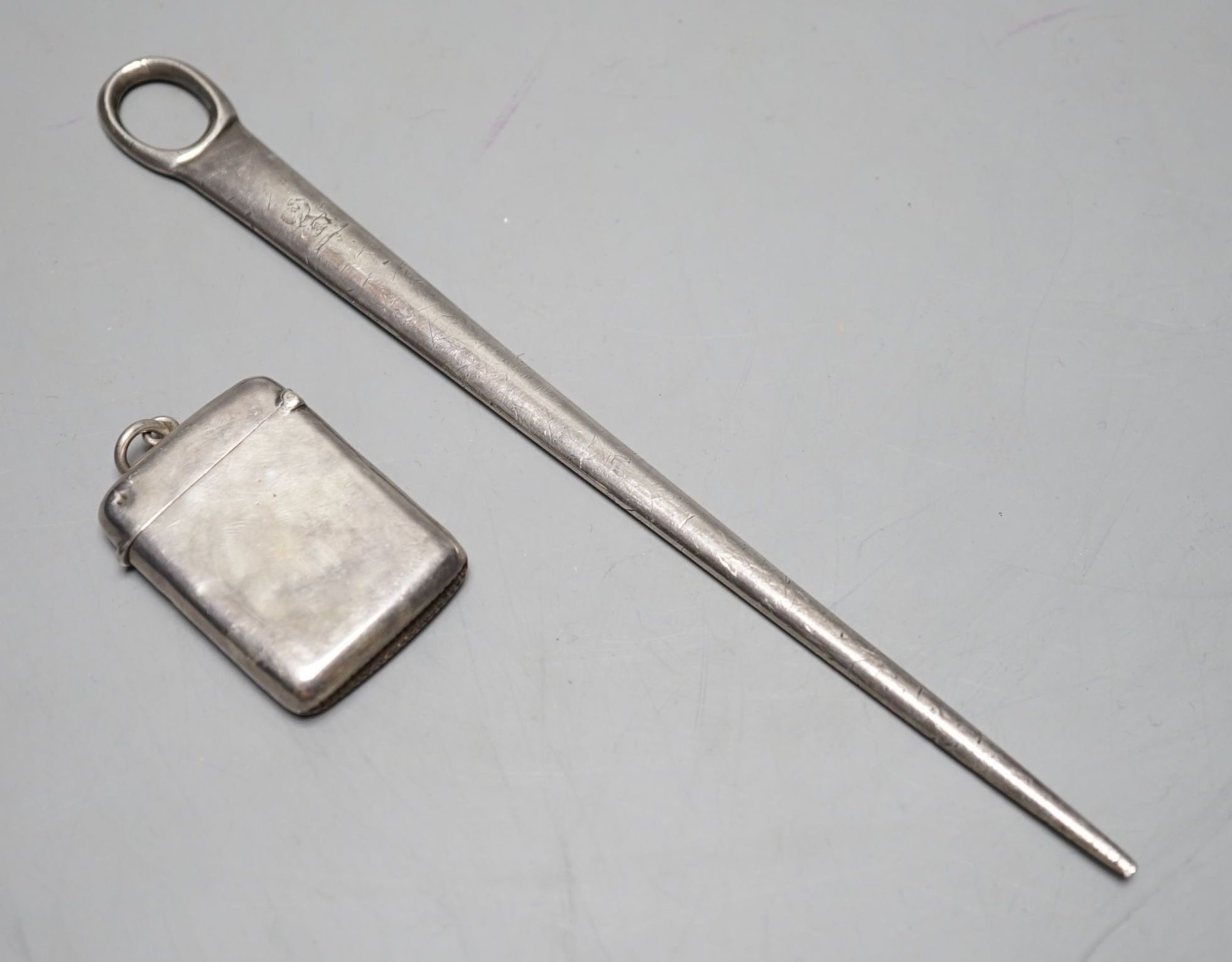 A George III Irish silver meat skewer, Richard Sawyer, Dublin, 1806, 19.4cm and a George V Irish silver vesta case.